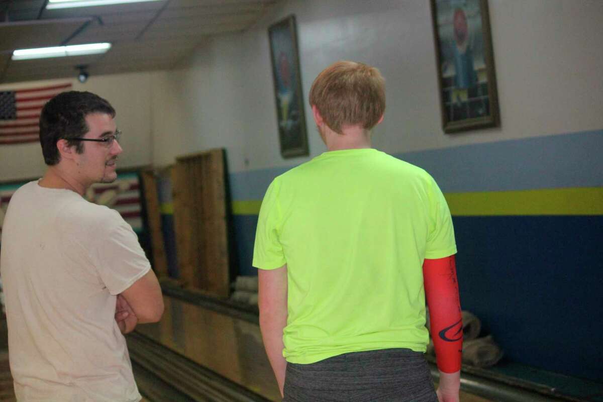 Baldwin bowling coach Donn Slimmen (left) talks with Jesse Pancio at a recent practice. (Star photo/John Raffel)