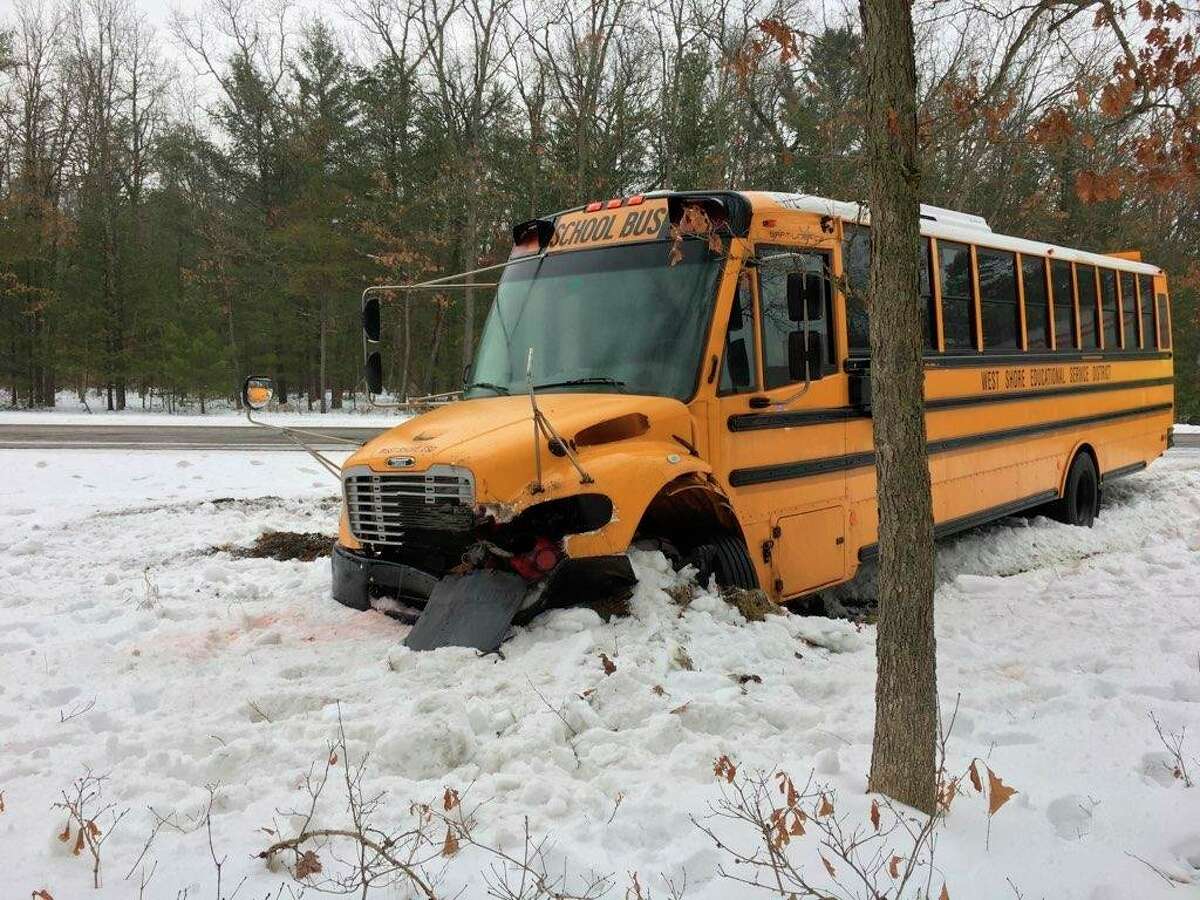 A West Shore Educational Service District bus was involved in a traffic crash Friday. A tractor trailer traveling east on U.S. 10 at Peacock Trail lost control and hit the front of the bus pushing it off the road. No injuries were reported. (Courtesy photo)
