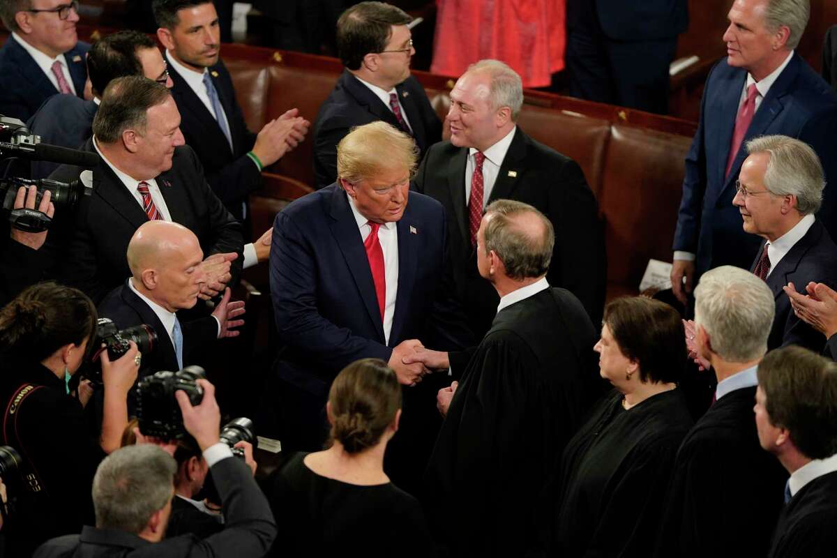 President Donald Trump greets Chief Justice John Roberts Jr. before the State of the Union address in the House chamber of the U.S. Capitol on Feb.y 4, 2020 in Washington, D.C.