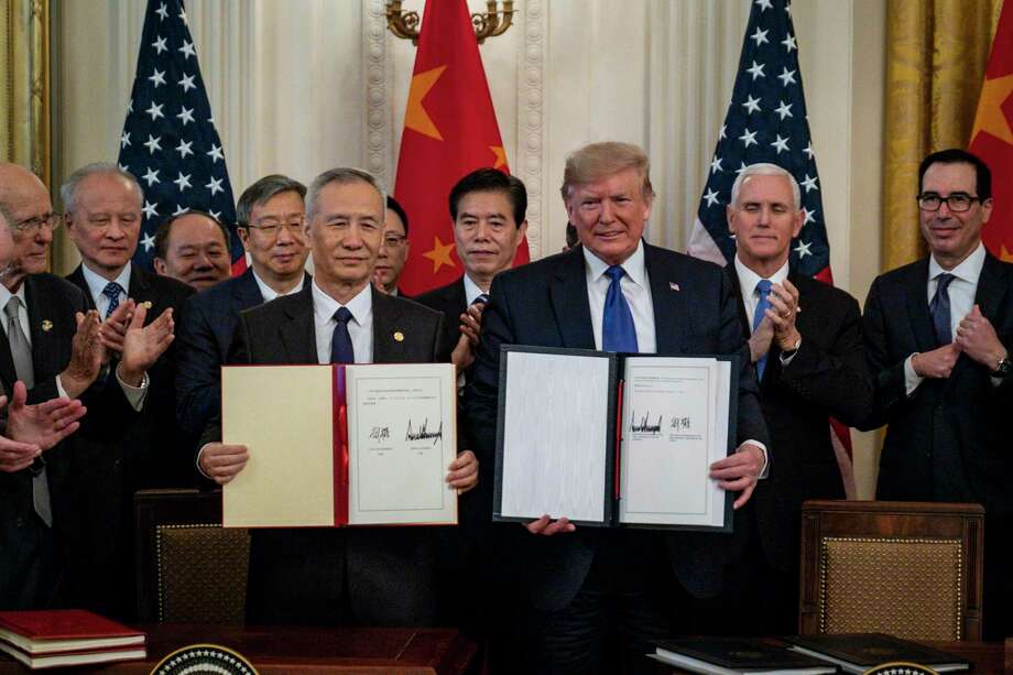 Under the trade deal signed by Chinese Vice Premier Liu He, left, and President Donald Trump, China has agreed to buy $200 billion worth of American goods and services this year, including more than $50 billion in energy products. The agreement also includes commitments by China to curtail practices that American companies say force them to hand over valuable intellectual property to Chinese firms. (Pete Marovich | The New York Times) / NYTNS