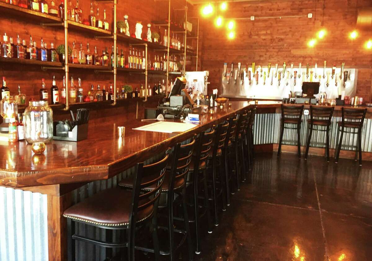The bar at Espuelas features 33 different beers on tap and more than 60 bottles of spirits.