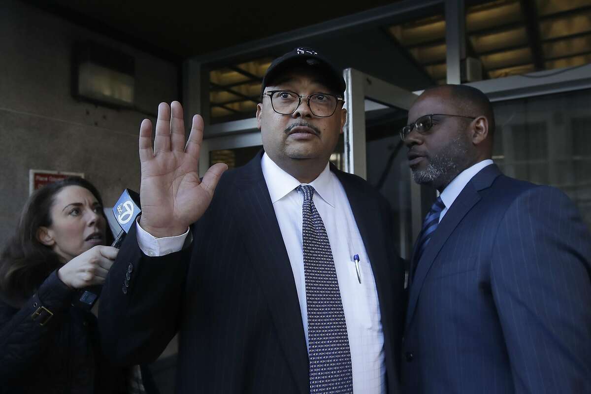Mohammed Nuru, director of San Francisco Public Works, center, gestures as he leaves a federal courthouse with attorney Ismail Ramsey, right, in San Francisco, Thursday, Feb. 6, 2020. The FBI arrested public works director Mohammed Nuru and restaurateur Nick Bovis last week, saying the men schemed in 2018 to bribe a San Francisco airport commissioner for prime restaurant space at San Francisco International Airport. (AP Photo/Jeff Chiu)