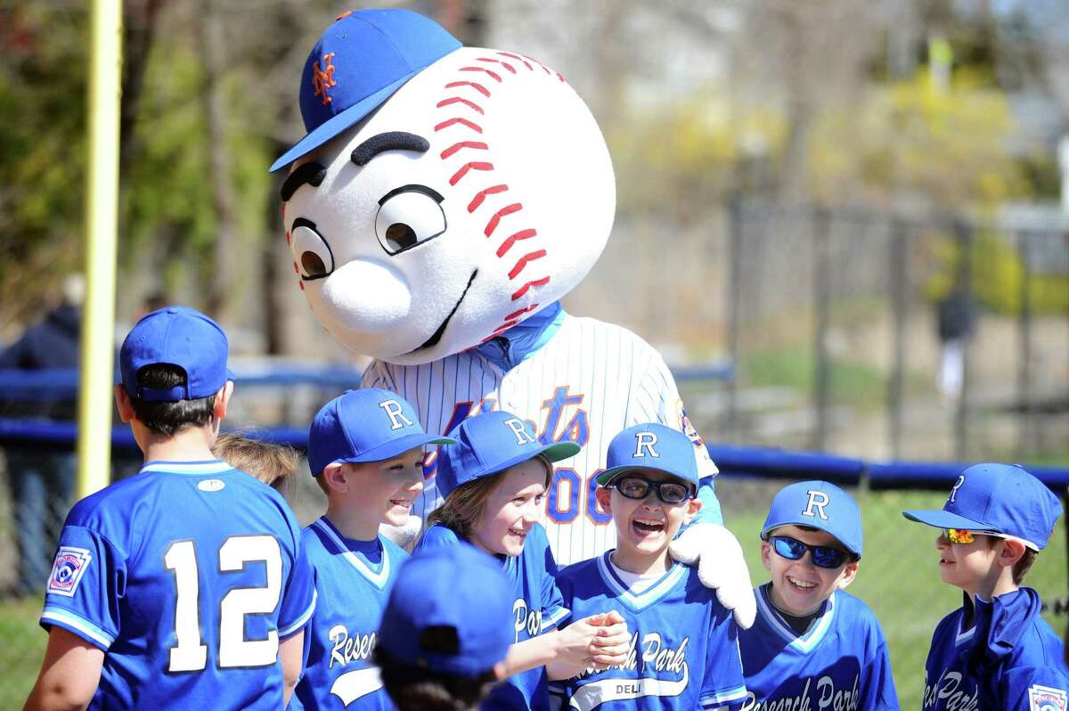 Players from the Research Park Deli team excitedly pose for a photo with Mr. Met following the Opening Day Little League Ceremony held on Caporizzo Field in Stamford, Conn. on Sunday, April 22, 2018.