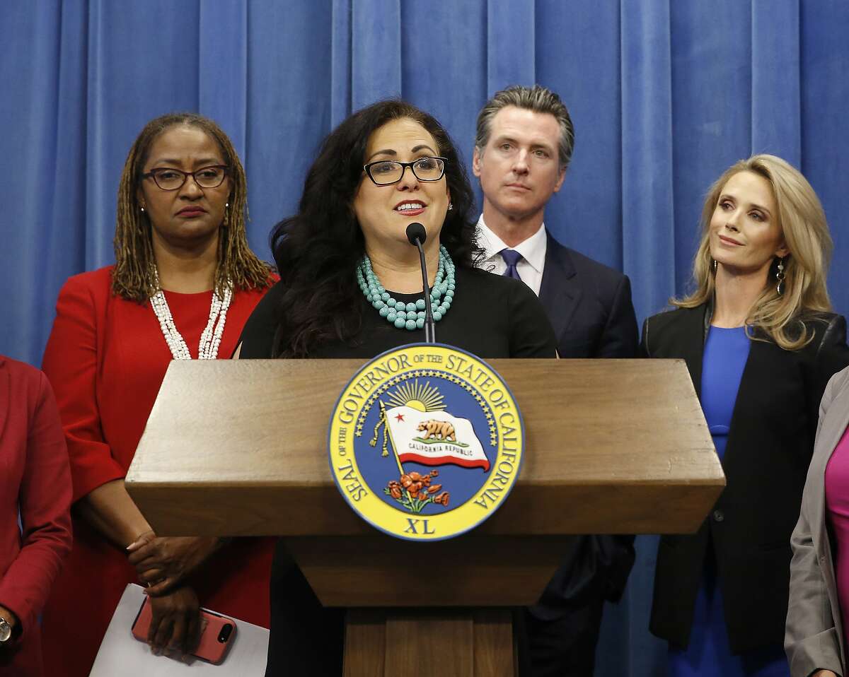 Assemblywoman Lorena Gonzalez discusses the proposal by Gov. Gavin Newsom, second from right, accompanied by his wife, Jennifer Siebel Newsom, right, to eliminate the state sales tax on tampons and diapers in his upcoming state budget during a news conference, Tuesday, May 7, 2019, in Sacramento, Calif. The tax cuts are part of a "parents' agenda" Newsom is pursuing, that he plans to unveil in his revised state budget later this week. At left is state Sen. Holly Mitchell, D-Los Angeles. (AP Photo/Rich Pedroncelli)