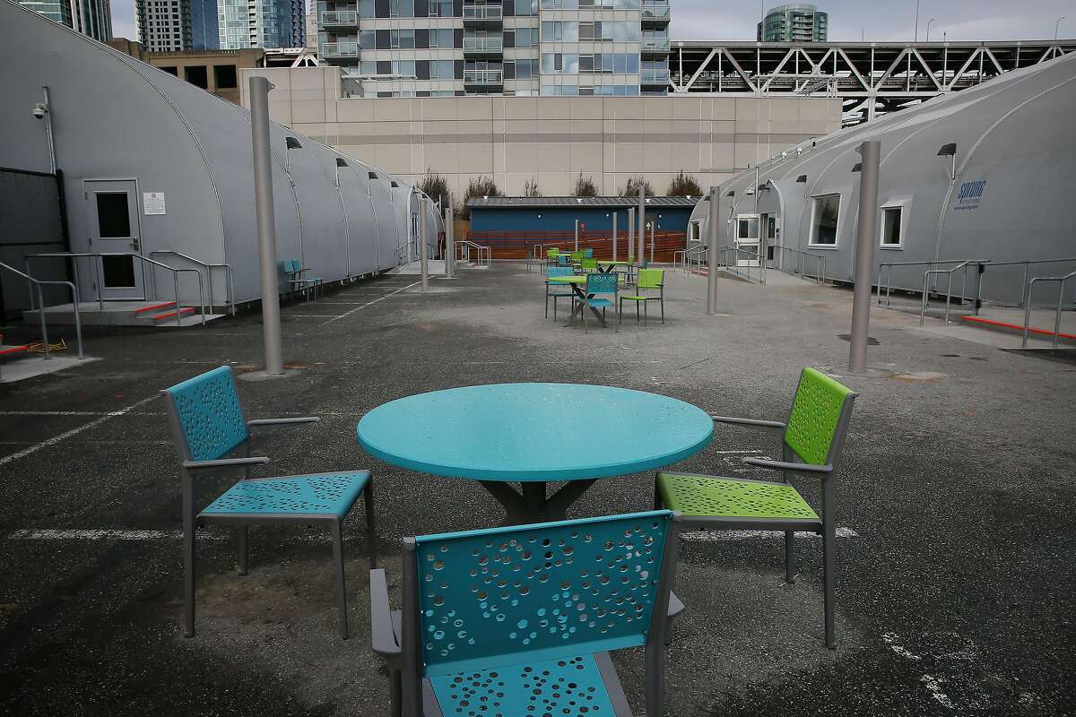 Tables and chairs are seen in the large central courtyard at the Embarcadero Safe Navigation Center on Wednesday, January 8, 2020 in San Francisco, Calif.