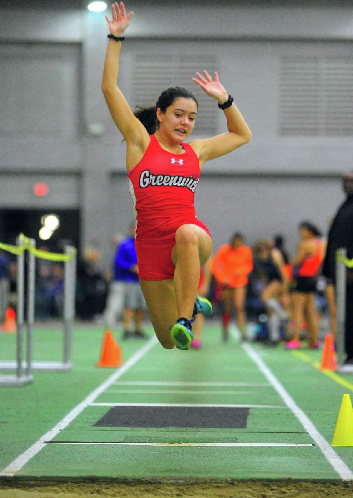 Greenwich’s Caroline Carvalho competes in the long jump during the FCIAC Indoor Track and Field Championships on Thursday in New Haven. For complete coverage of the meet visit greenwichtime.com/sports.