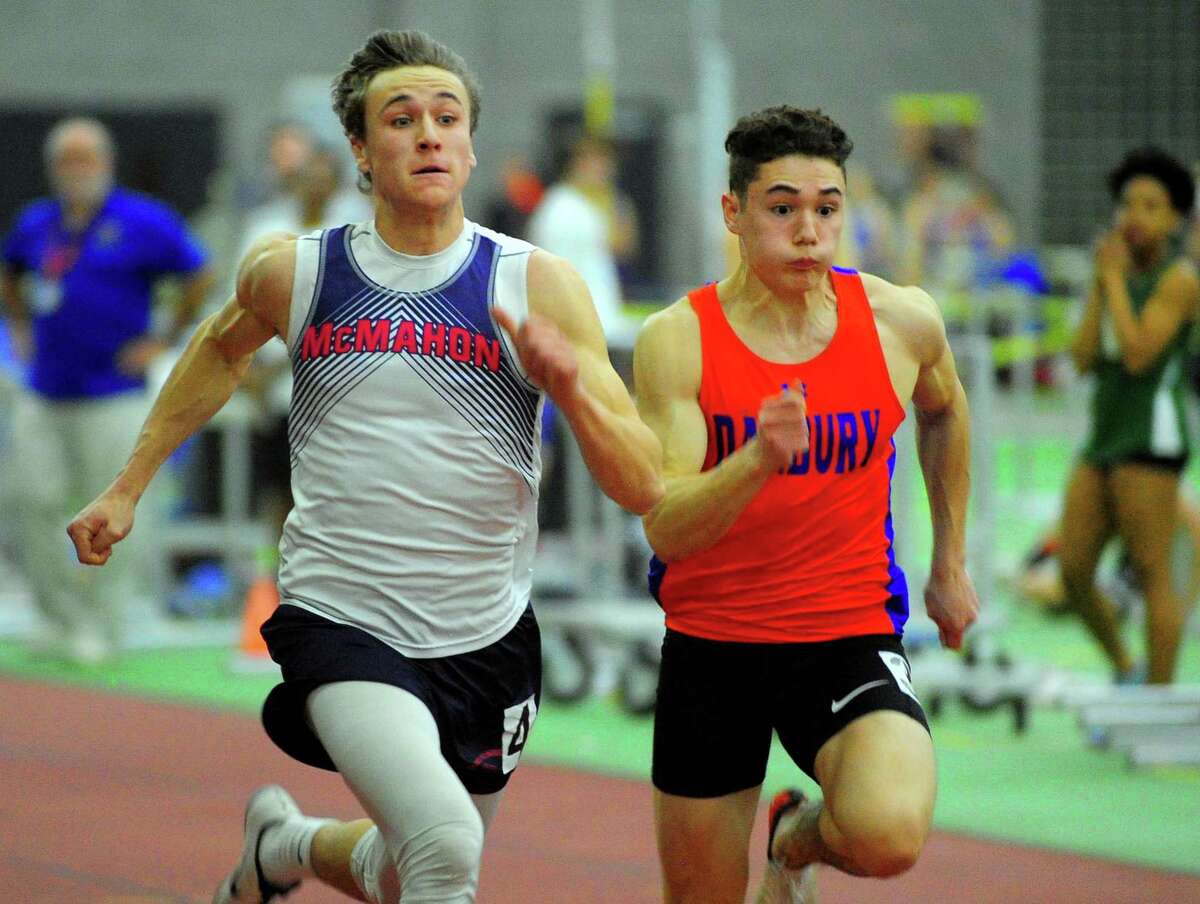 Brien McMahon's Korey Morton, left, and Danbury's Jaden Cazorla compete in the 55 meter dash finals during FCIAC Track Championship action in New Haven, Conn., on Thursday Feb. 6, 2020.