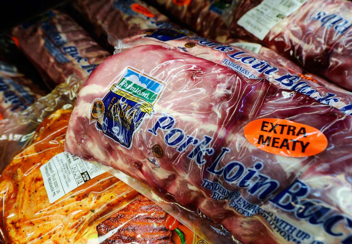 PICO RIVERA, CA - MAY 30: Farmland pork products are on sale at a supermarket on May 30, 2013 in Pico Rivera, California. Farmland is a brand owned by Smithfield Foods Inc, which is the biggest pork producer in the world. A Chinese company based in Hong Kong, Shuanghui International Holdings Ltd. has agreed to buy Smithfield Foods Inc. for approximately $4.72 billion. (Photo by Kevork Djansezian/Getty Images)