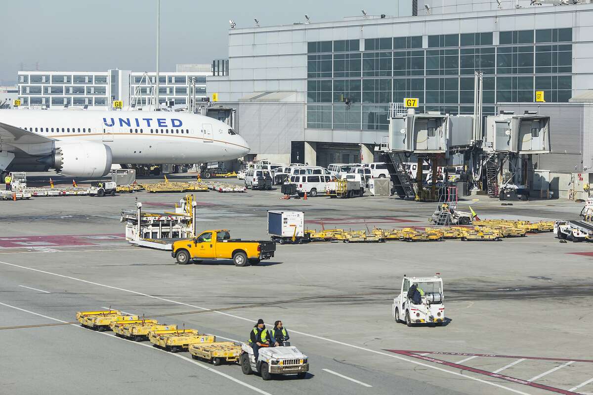 United planes are parked on the tarmac at the international terminal on Friday, February 7, 2020 in San Francisco, Calif. SFO and its businesses have seen a 2.5% reduction in total passenger traffic and flight cancellations to China because of the coronavirus outbreak.