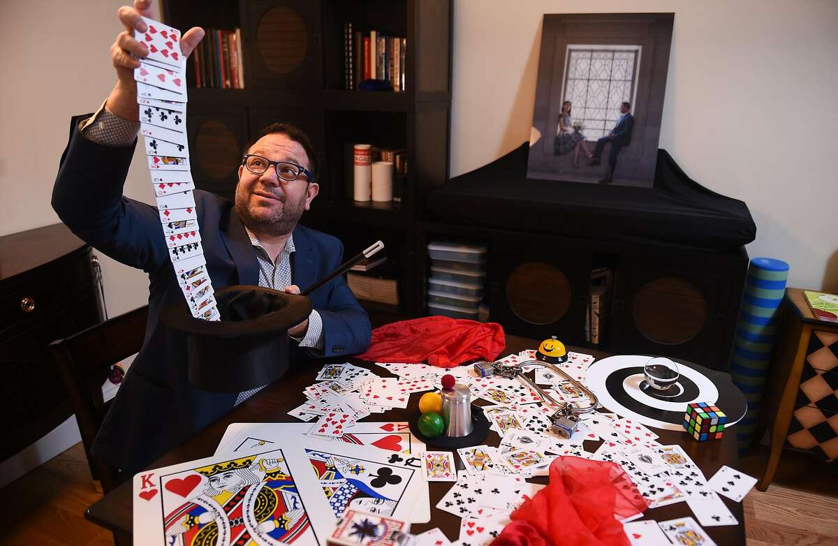 Robert Strong, The Comedy Magician, rehearses tricks at his Palo Alto home on Friday February 7, 2020. Strong recently established an LLC to avoid employment restrictions on his performances.
