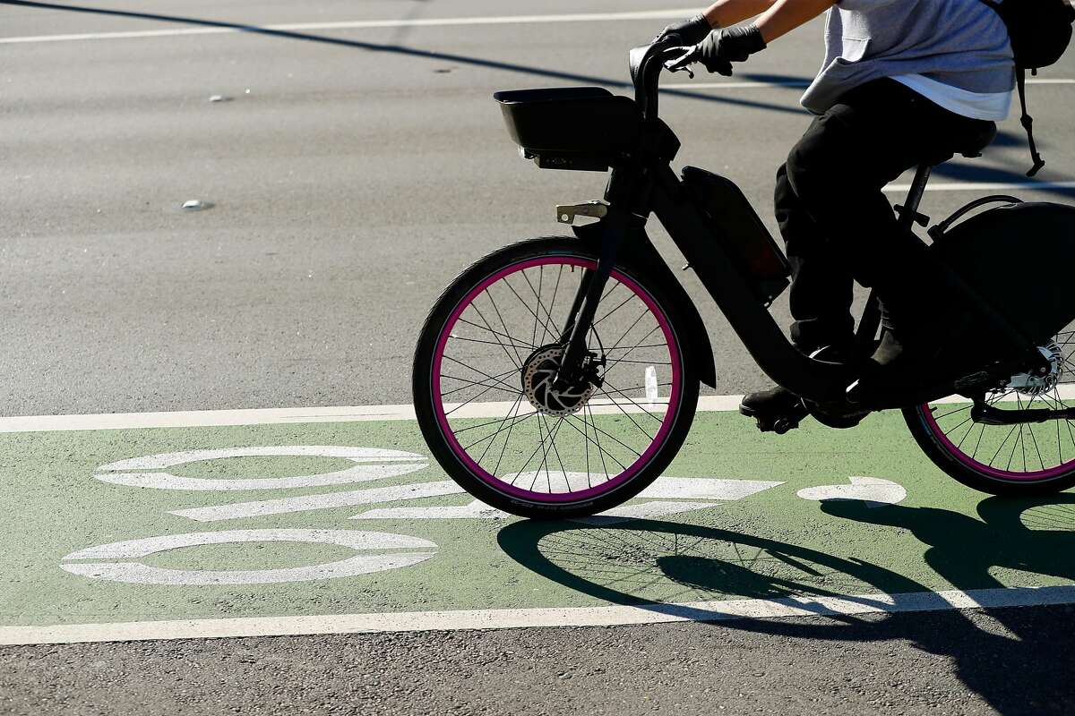 The tragic death of a pedicab driver and plenty of near-accidents have bicycling advocates lobbying for a barrier. Businesses along the Embarcadero are nervous.