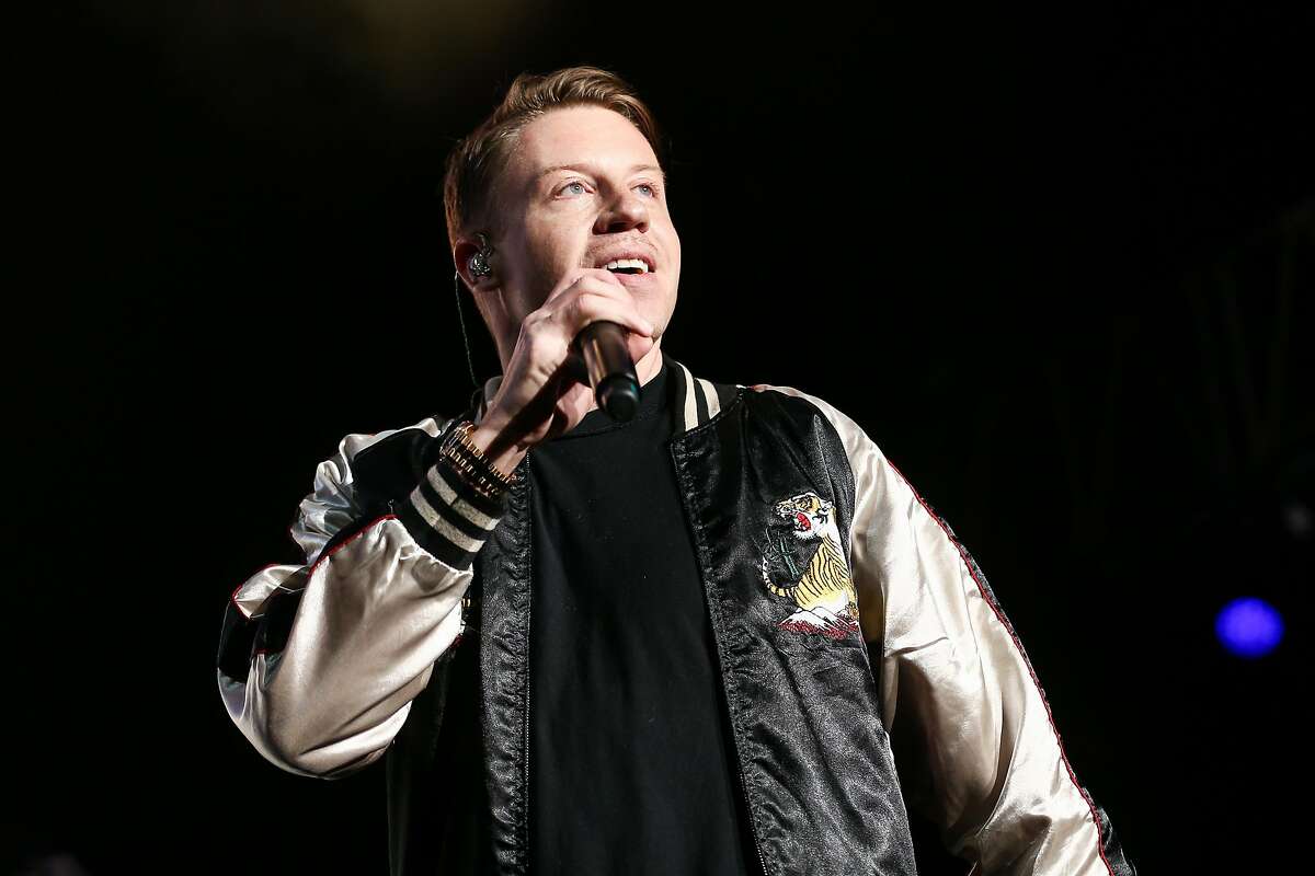 FILE - In this Dec. 4, 2015 file photo, Macklemore performs on stage at Power 106's Cali Christmas 2015 in Inglewood, Calif. Macklemore explores racism and hip-hop in a new song called “White Privilege II," rapping about a white person’s position in society with black people fighting injustice. (Photo by John Salangsang/Invision/AP, File)