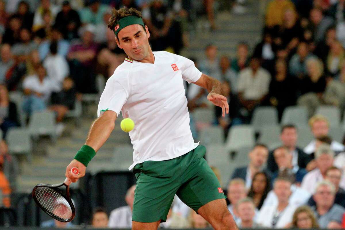 Switzerland's Roger Federer plays a return to Spain's Rafael Nadal during their tennis match at The Match in Africa at the Cape Town Stadium, in Cape Town on February 7, 2020. (Photo by RODGER BOSCH / AFP) (Photo by RODGER BOSCH/AFP via Getty Images)