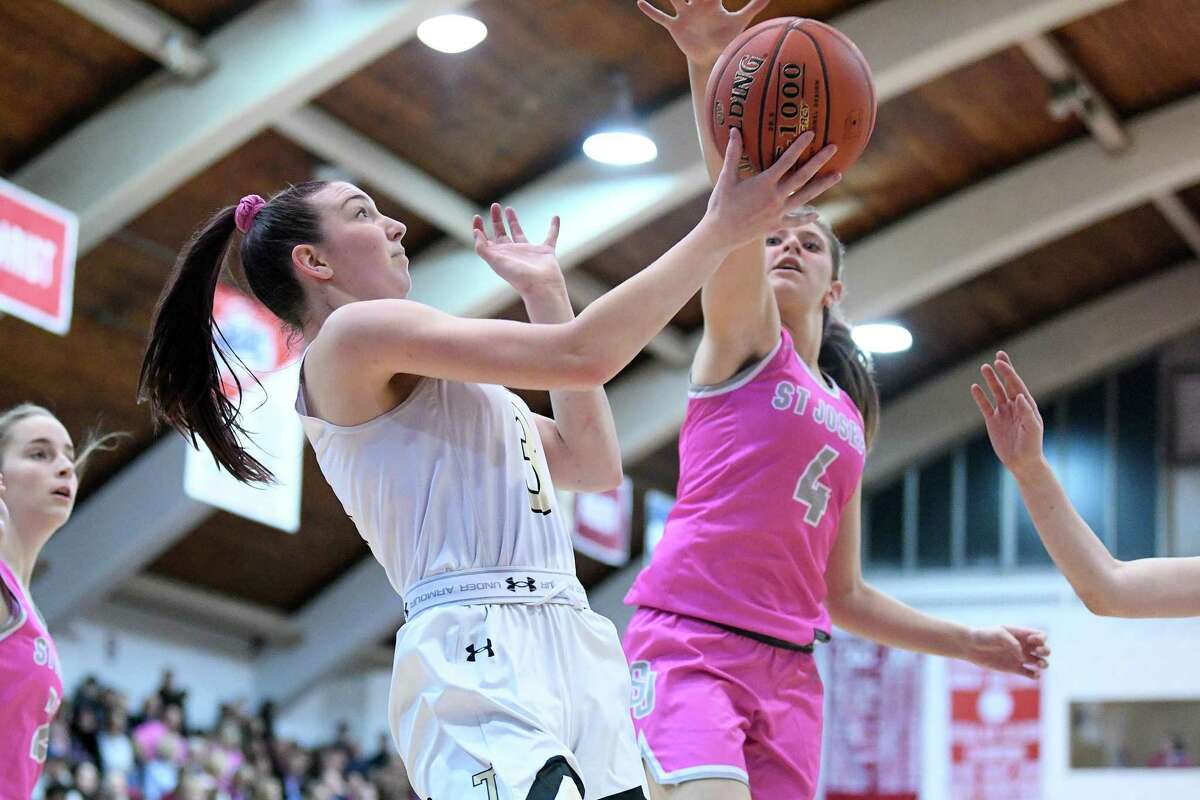 Trumbull High’s Emi Roberto puts up two against St. Joseph in the first game of the Playing for a Cure doubleheader at Fairfield University’s Alumni Hall, Friday, Feb. 7, 2020.