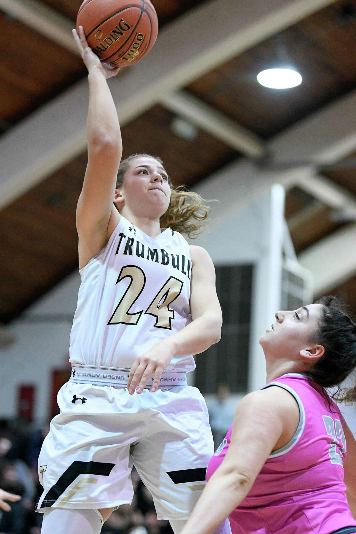 Trumbull High’s Cassi Barbato drives against St. Joseph in the first game of the Playing for a Cure doubleheader at Fairfield University’s Alumni Hall, Friday, Feb. 7, 2020.