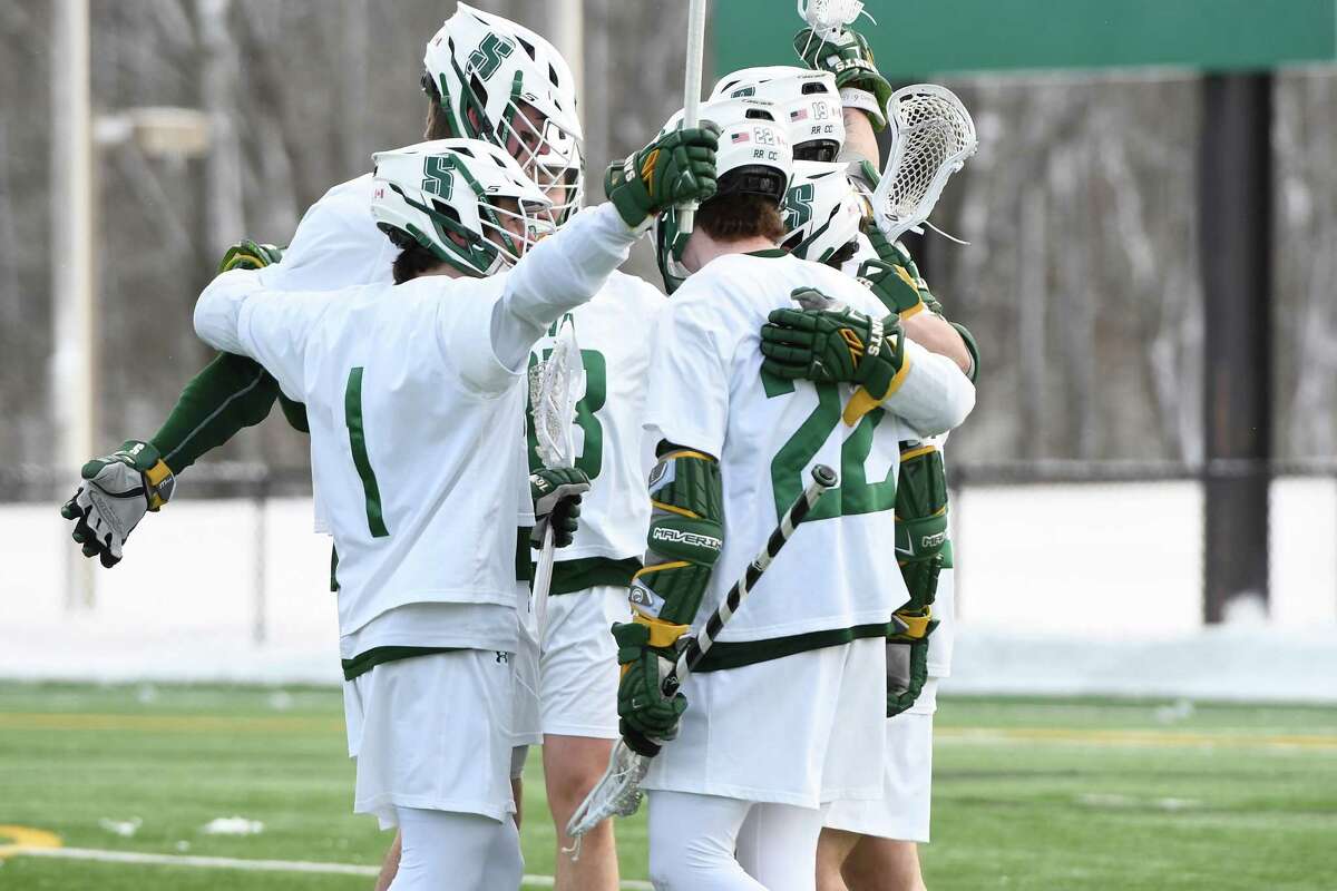 Siena lacrosse players celebrate a goal against Long Island University during Siena's season opener at the college's Hickey Field on Saturday, Feb. 8, 2020 in Latham, N.Y. (Jenn March, Special to the Times Union )