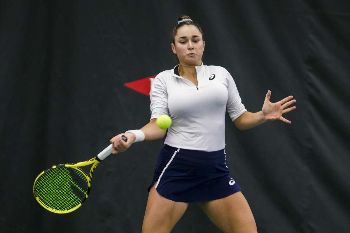 Caroline Dolehide of the USA returns the ball in a doubles match with partner Maria Sanchez of the USA against Yanina Wickmayer of Belgium and Valeria Savinykh of Russia during the Dow Tennis Classic Saturday, Feb. 8, 2020 at the Greater Midland Tennis Center in Midland. (Katy Kildee/kkildee@mdn.net)
