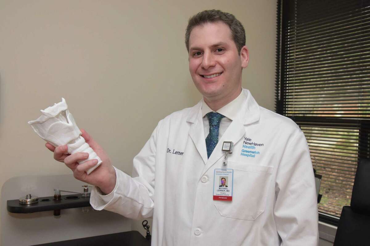 Dr. Michael Lerner, a fellowship-trained Yale Medicine laryngologist, holds a model of the larynx or voice box at the new Yale Voice Center at Greenwich Hospital at 55 Holly Hill Lane, Greenwich. Dr. Lerner is an ear, nose and throat physician specially trained to treat conditions of the larynx