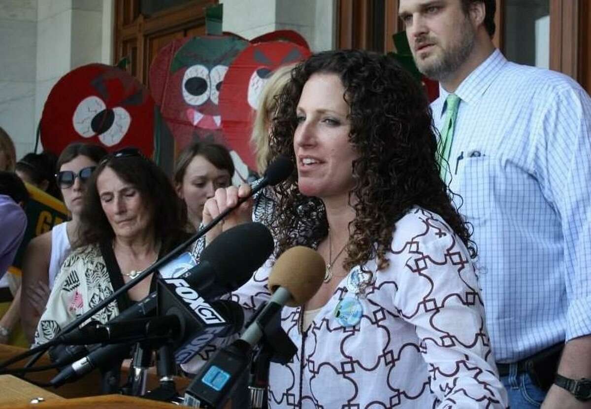 Tara Cook-Littman, of Fairfield, has researched the applications in Connecticut of the controversial pesticide chloropyifos, which is banned in Europe and banned in the United States for most household use. She is shown at a rally at the state Capitol for food safety labeling.