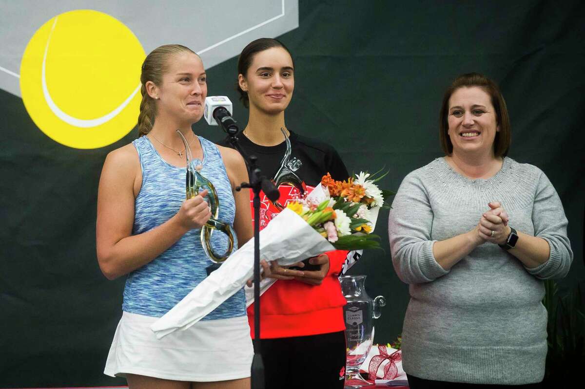Singles champion Shelby Rogers, left, addresses the crowd during the award ceremony for the Dow Tennis Classic singles tournament Sunday, Feb. 9, 2020 at the Greater Midland Tennis Center. At center is runner-up Anhelina Kalinina, and at right is tournament director Talaya Schilb. It was announced Monday that the 2021 Dow Tennis Classic will be postponed from February 2021 to November 2021, due to the coronavirus pandemic. (Katy Kildee/kkildee@mdn.net)