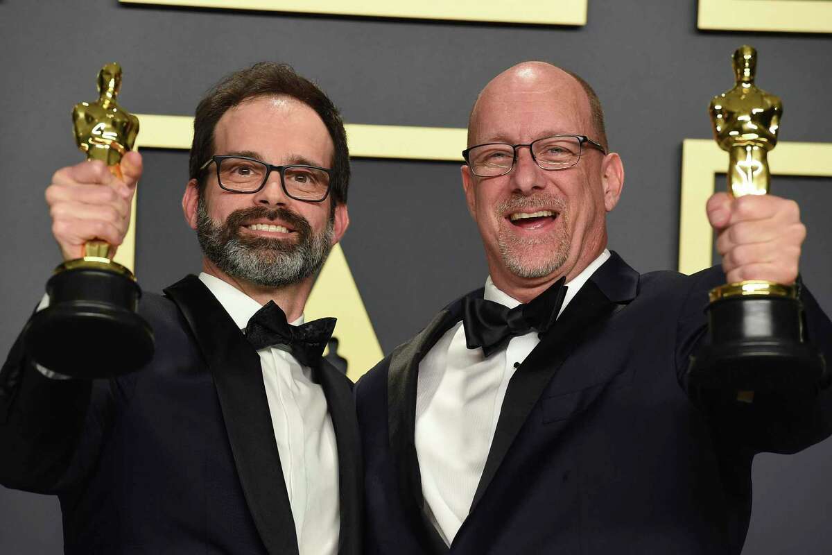 Andrew Buckland, left, and Michael McCusker, winners of the award for best film editing for "Ford v Ferrari", pose in the press room at the Oscars Sunday night, February 9, 2020, at the Dolby Theatre in Los Angeles. (Photo by Jordan Strauss/Invision/AP)
