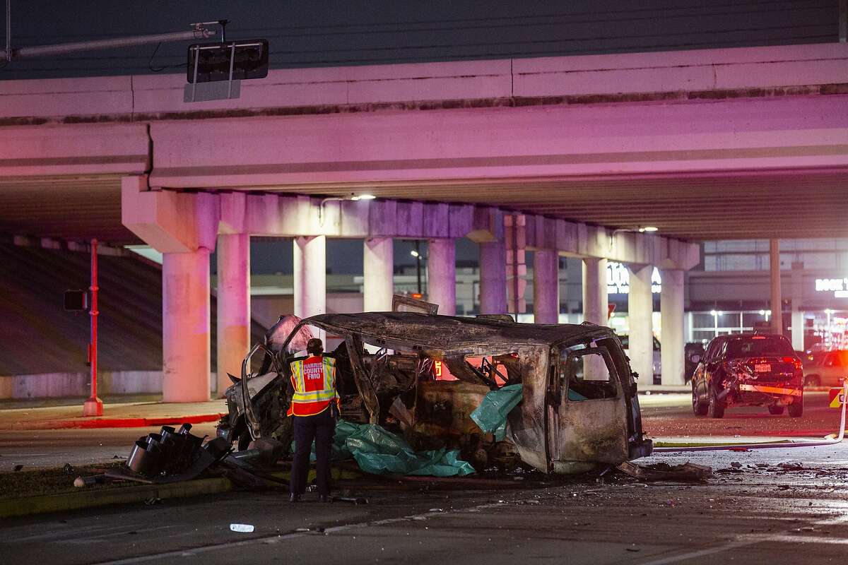 Authorities investigate a crash on Antoine Drive at the North Sam Houston Parkway underpass that killed three people on Wednesday, Feb. 5, 2020, in Houston.