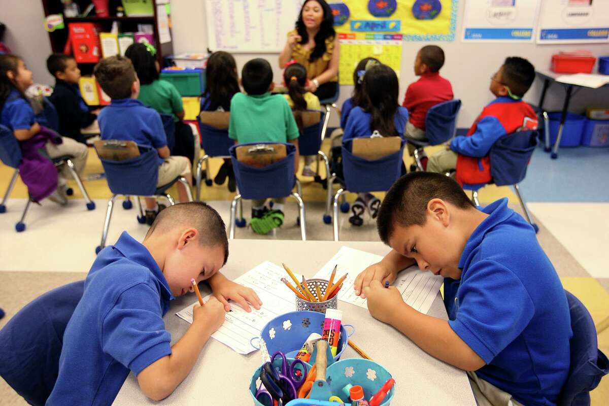 In this 2012 photo, students concentrate on a task during a kindergarten English class at an IDEA school. Some recent financial decisions at IDEA show the need for greater public scrutiny.
