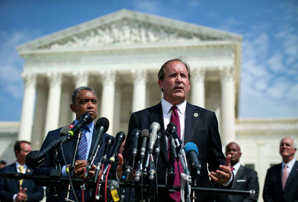 FILE -- Texas Attorney General Ken Paxton speaks at a news conference as District of Columbia Attorney General Karl Racine, left, and other state attorneys general look on, outside the Supreme Court in Washington, Sept. 9, 2019. In a petition filed on Oct. 31 in Texas state court of Travis County, Google, along with its parent company Alphabet, sought a protective order against Paxton, who is spearheading the multistate antitrust investigation into the company. (Al Drago/The New York Times)
