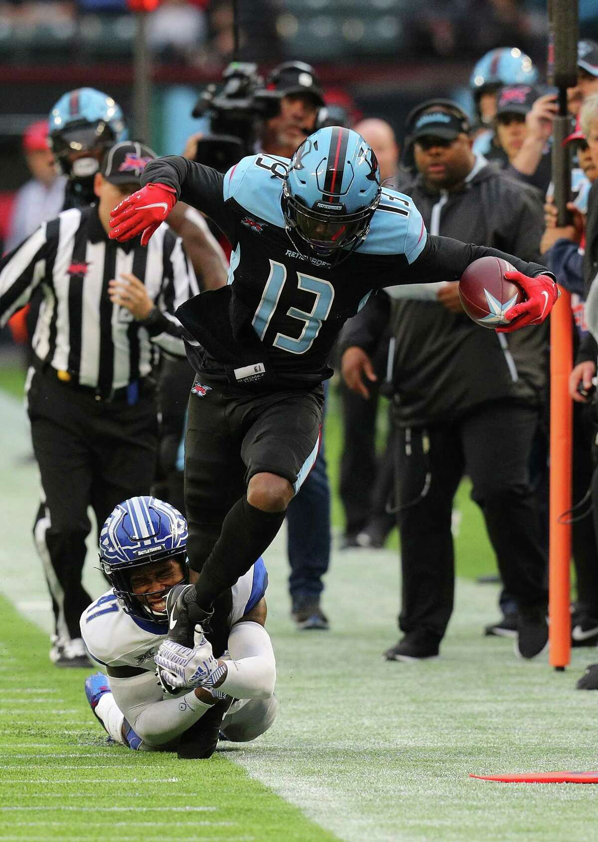 ARLINGTON, TEXAS - FEBRUARY 09: Darius Hillary #41 of the St. Louis Battlehawks tackles Jeff Badet #13 of the Dallas Renegades in the first half of an XFL Football game on February 09, 2020 in Arlington, Texas. (Photo by Richard Rodriguez/Getty Images)
