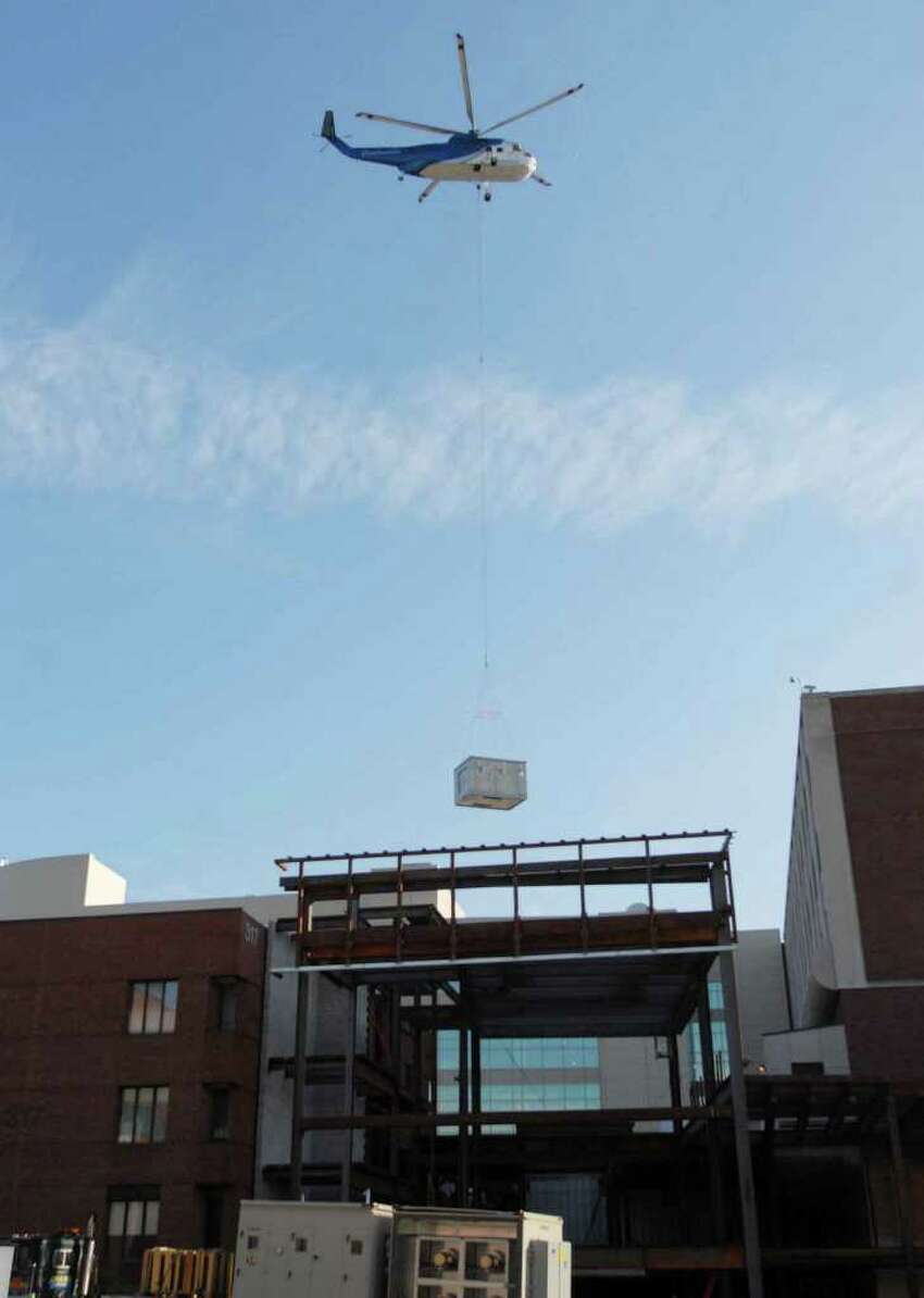 Photos: Helicopter delivers air-handling unit to hospital roof