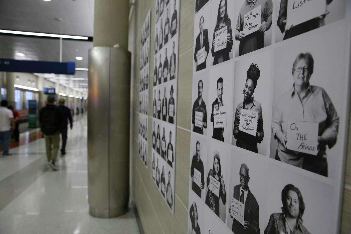Photographs taken by Sarah Brooke Lyons for her “1005 Faces” exhibit line the walls between Gates A-4 and A-6 of the San Antonio International Airport in celebration of Black History Month.