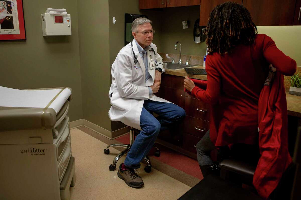 Dr. Roger Moczygemba sees patient Antrea Ferguson at Direct Med Clinic in San Antonio. Moczygemba offers a membership-based model of medical care that bucks traditional health care billing practices.