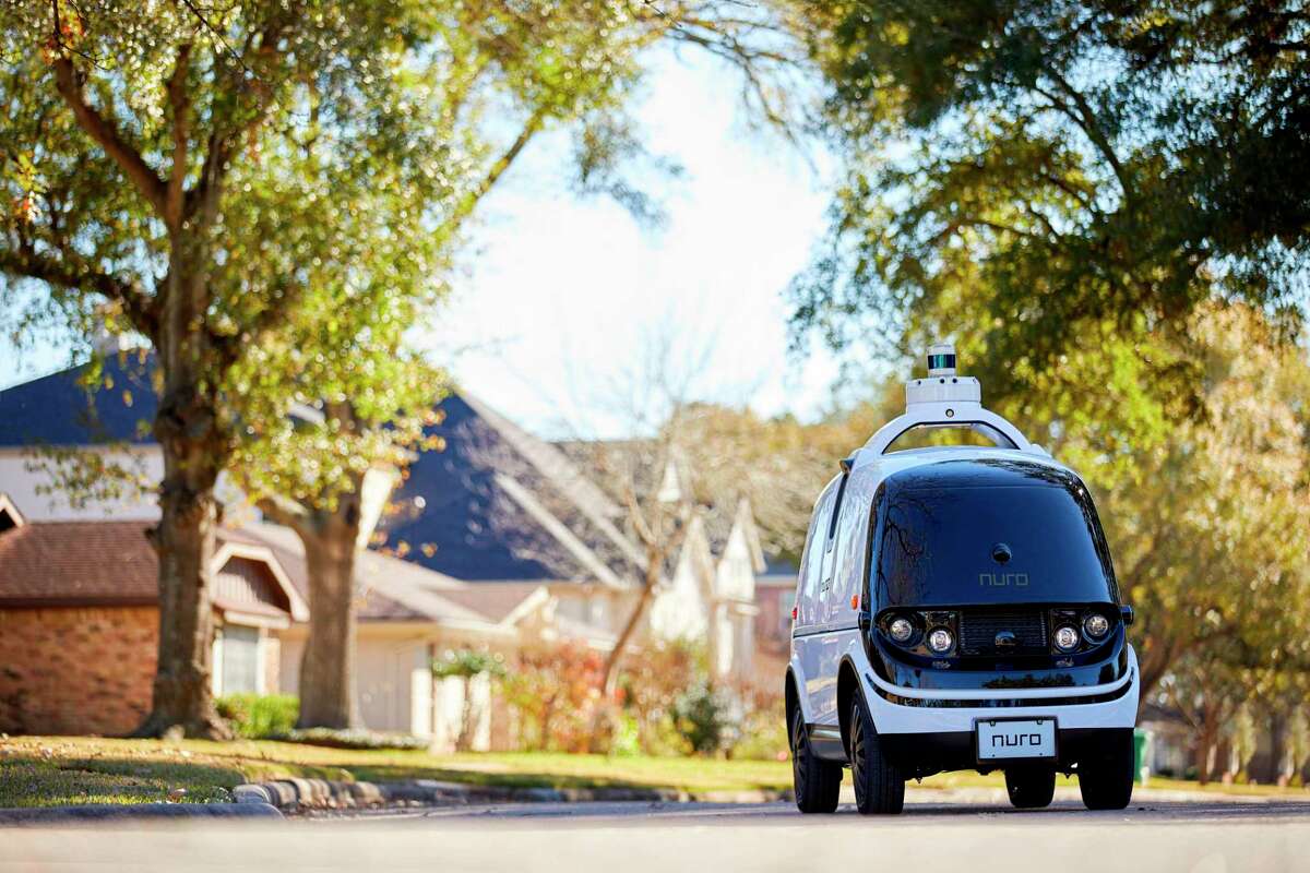 The R2 self-driving delivery vehicle driving in Houston, Texas. Nuro said its R2 vehicle, designed to operate without any human driver, would be partnering with local businesses for "last-mile delivery of consumer products, groceries, and hot food from local stores and restaurants."