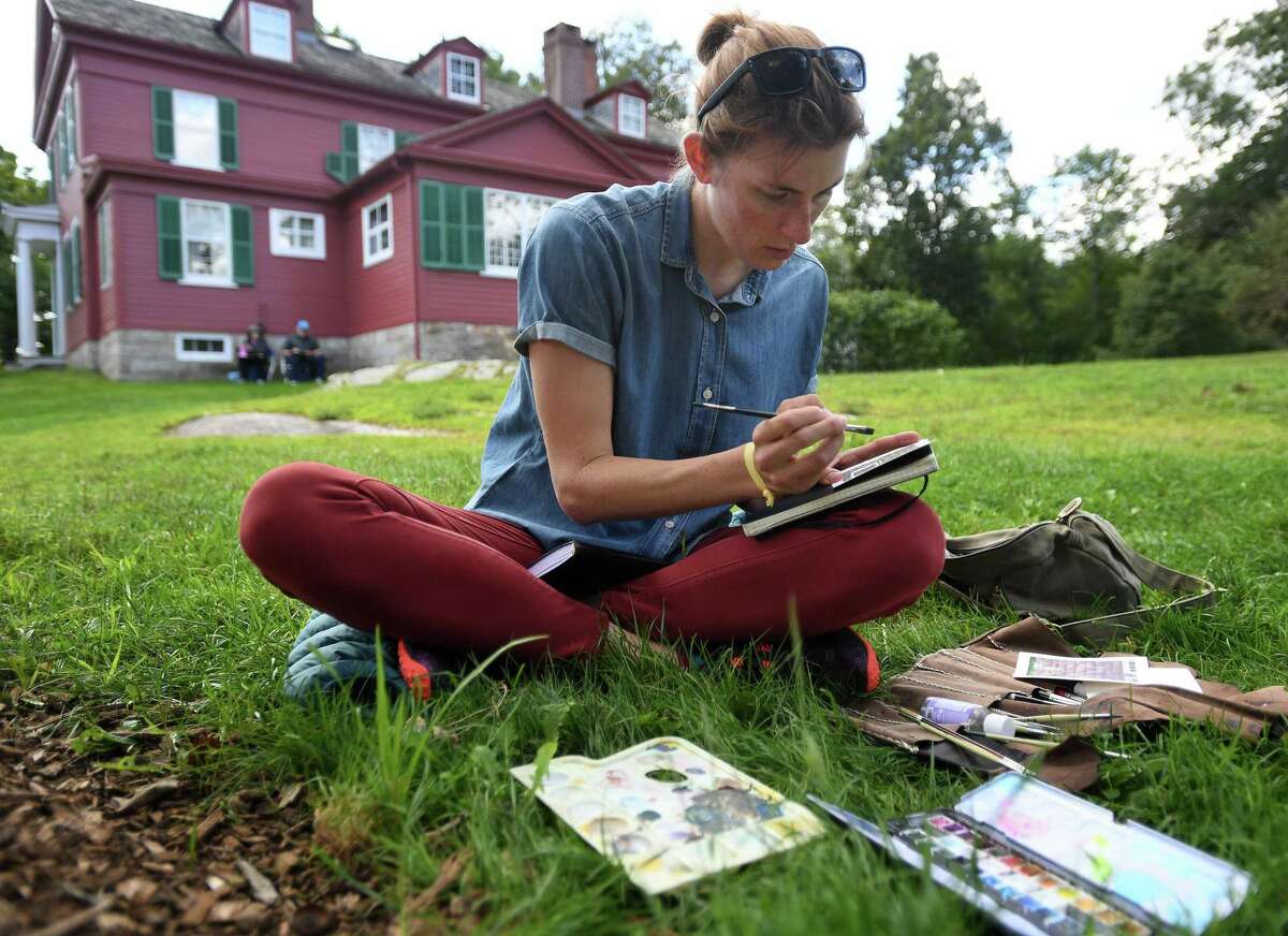 MaryEllen Hackett, a resident of Sequoia National Park in California, paints during the Art in the Park Annual Festival at Weir Farm National Historic Site, in Wilton and Ridgefield, Conn. on Sunday, August 25, 2019. The site was the summer residence of American Impressionist painter J. Alden Weir.