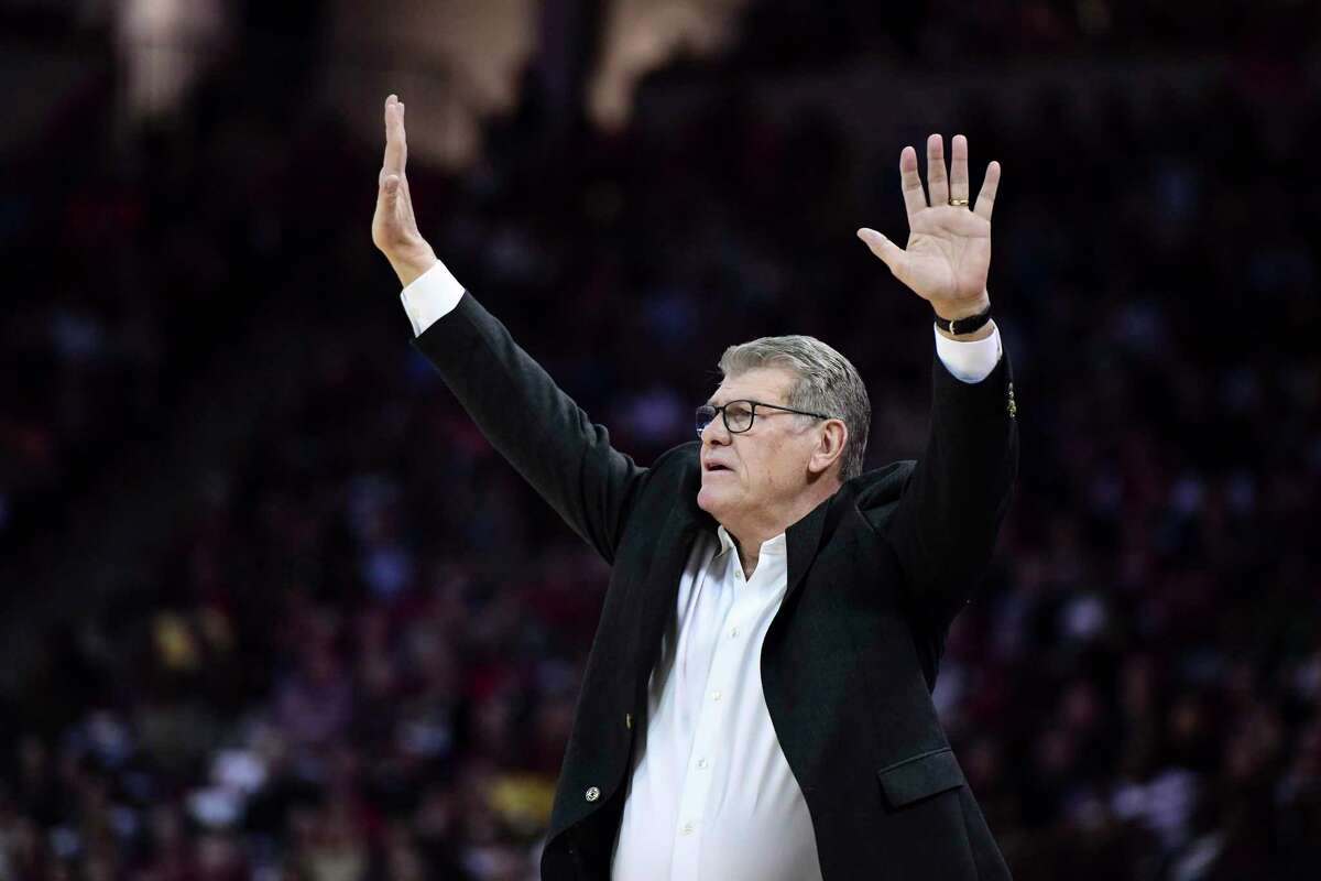 UConn women’s basketball coach Geno Auriemma communicates with players during the first half against South Carolina in February.