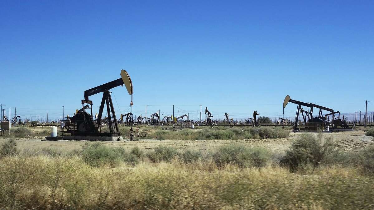 FILE - This June 12, 2017 file photo shows pumpjacks operating in the western edge of California's Central Valley northwest of Bakersfield.