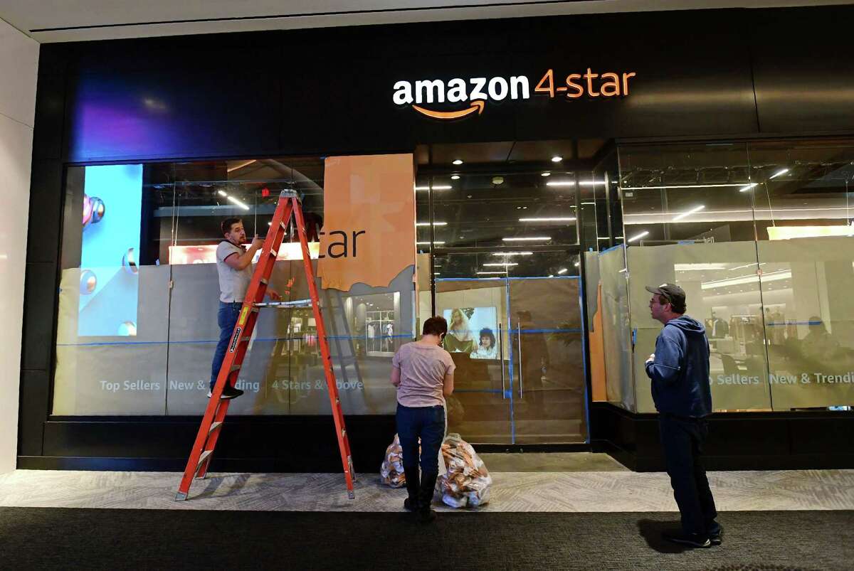 Workers put the finishing touches on the first Amazon 4-star storefront in Connecticut on Tuesday, February 11, 2020, at The SoNo Collection mall in Norwalk, Conn. Amazon 4-star stores are stocked with a selection of highly rated products from Amazon.com that are continually rotated due to their popularity.