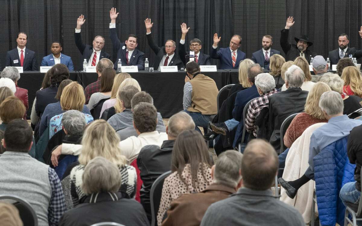 Candidates running for District 11 Congressional seat raise their hands when ask about past votes 02/11/2020 evening at a candidate forum at the Horseshoe Arena Trail. Tim Fischer/Reporter-Telegram