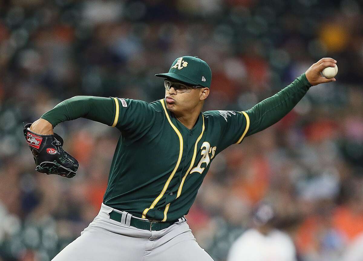 HOUSTON, TEXAS - SEPTEMBER 11: Jesus Luzardo #44 of the Oakland Athletics pitches in the sixth inning against the Houston Astros at Minute Maid Park on September 11, 2019 in Houston, Texas. This was Luzrdo's major league debut. ~~