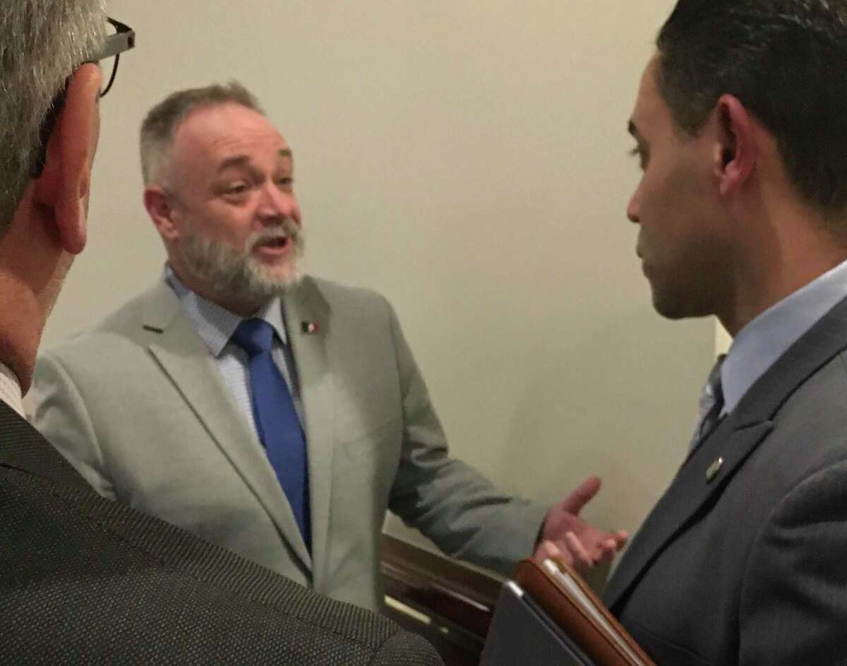 Rep. Kurt Vail, R-Stafford, a member of the General Assembly's public safety committee, talks with Rodney Butler of the Mashantucket Pequot Tribe outside a forum on gaming expansion at the Legislative Office Building in Hartford, Tuesday, Feb. 11, 2020.