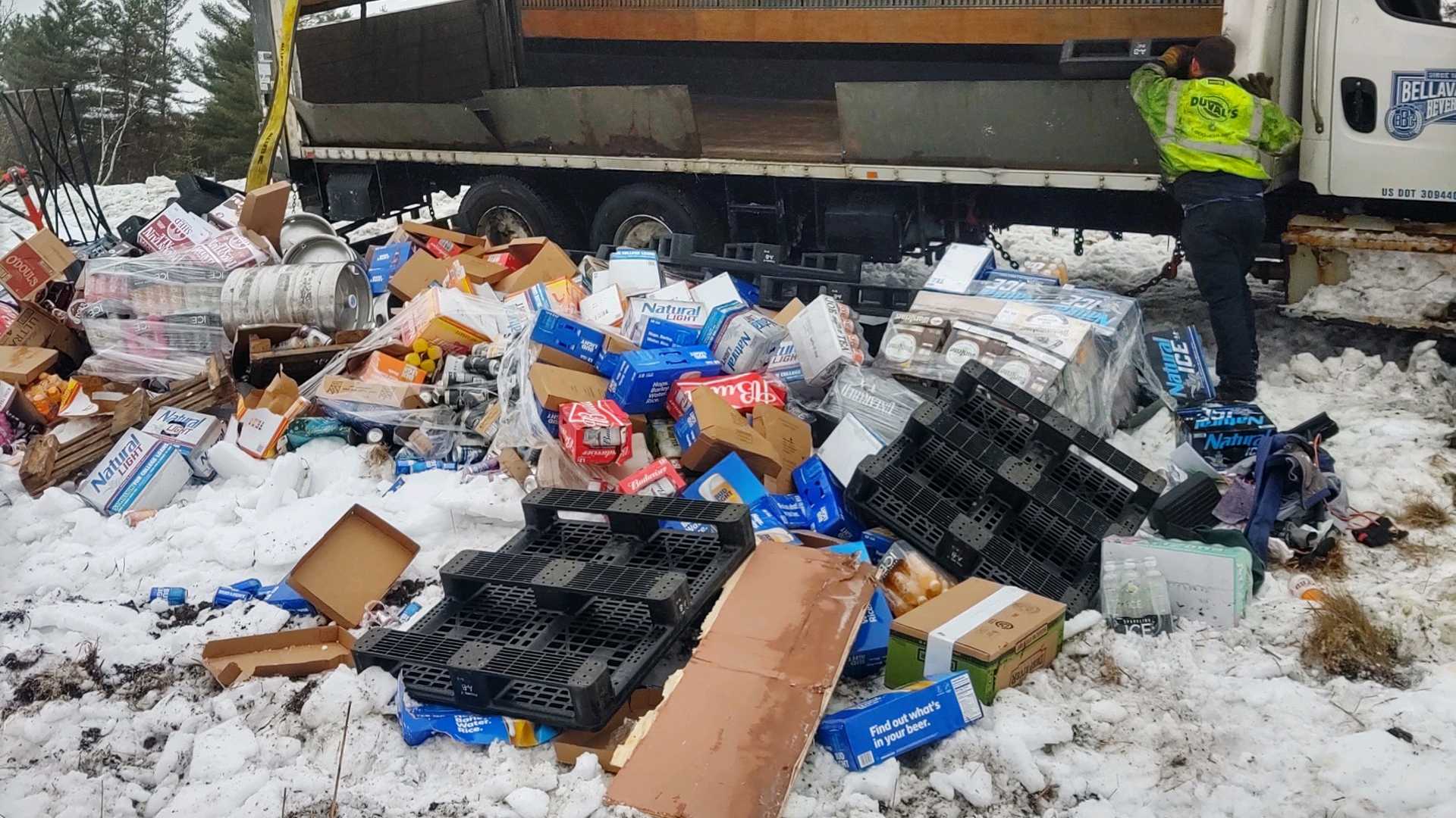 Beer truck crashes, spills cases and kegs of brews onto interstate