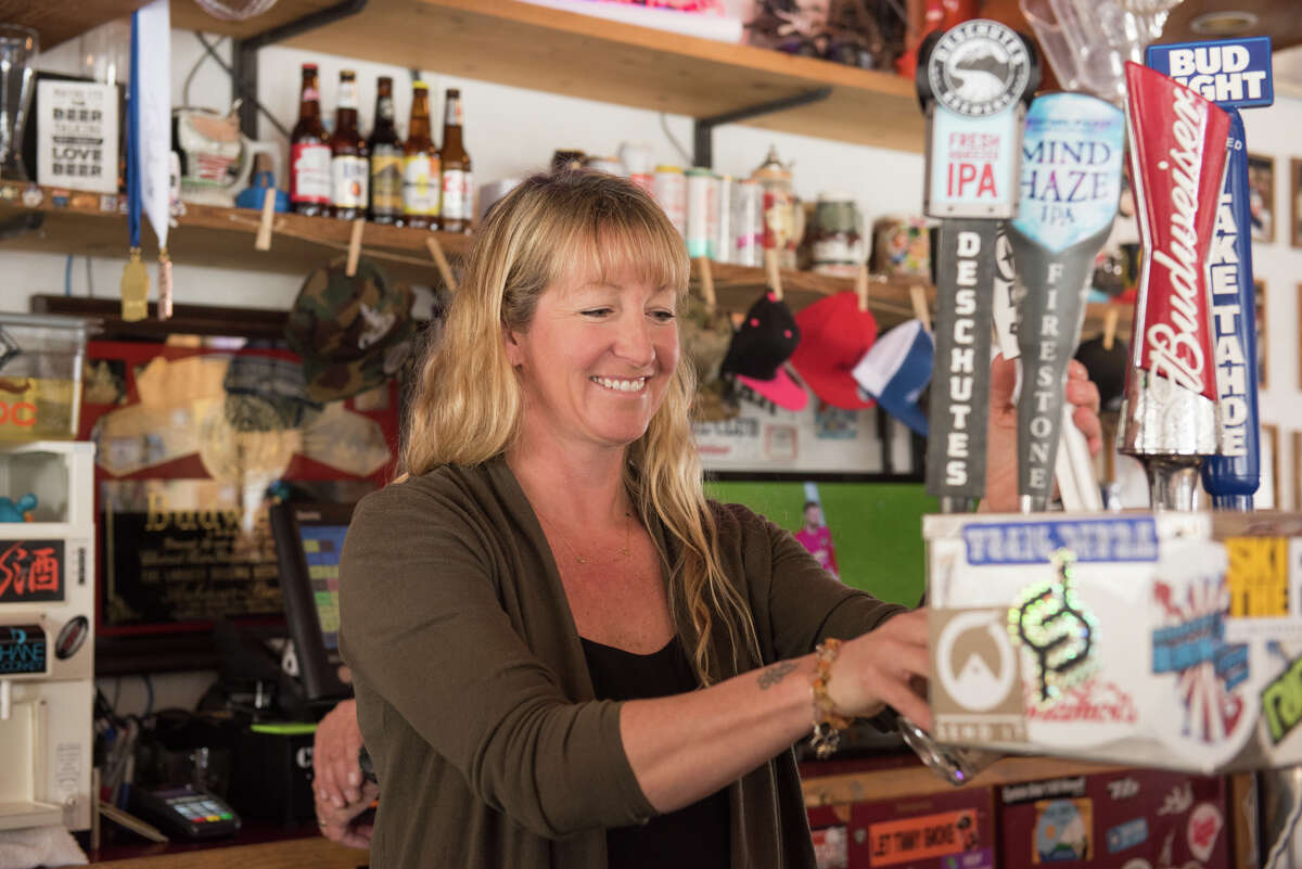 Co-owner Katja Dahl pours a beer at Le Chamois in Squaw Valley.