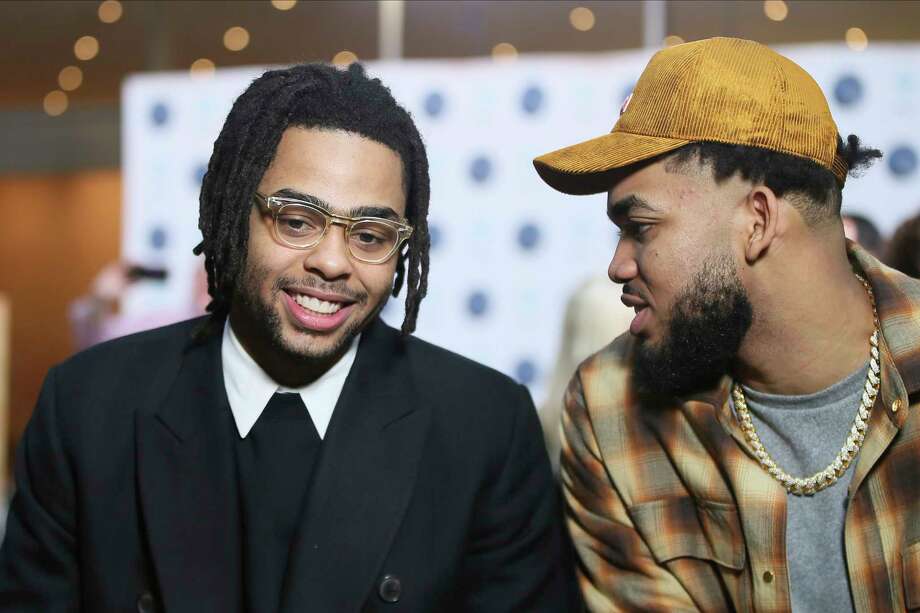 New Minnesota Timberwolves NBA basketball player D'Angelo Russell, left, chats with Timberwolves' Karl-Anthony Towns after Russell was introduced at a news conference, Friday, Feb. 7, 2020, in Minneapolis, following a trade that sent Timberwolves' Andrew Wiggins to the Golden State Warriors. Photo: Jim Mone, AP / Copyright 2020 The Associated Press. All rights reserved