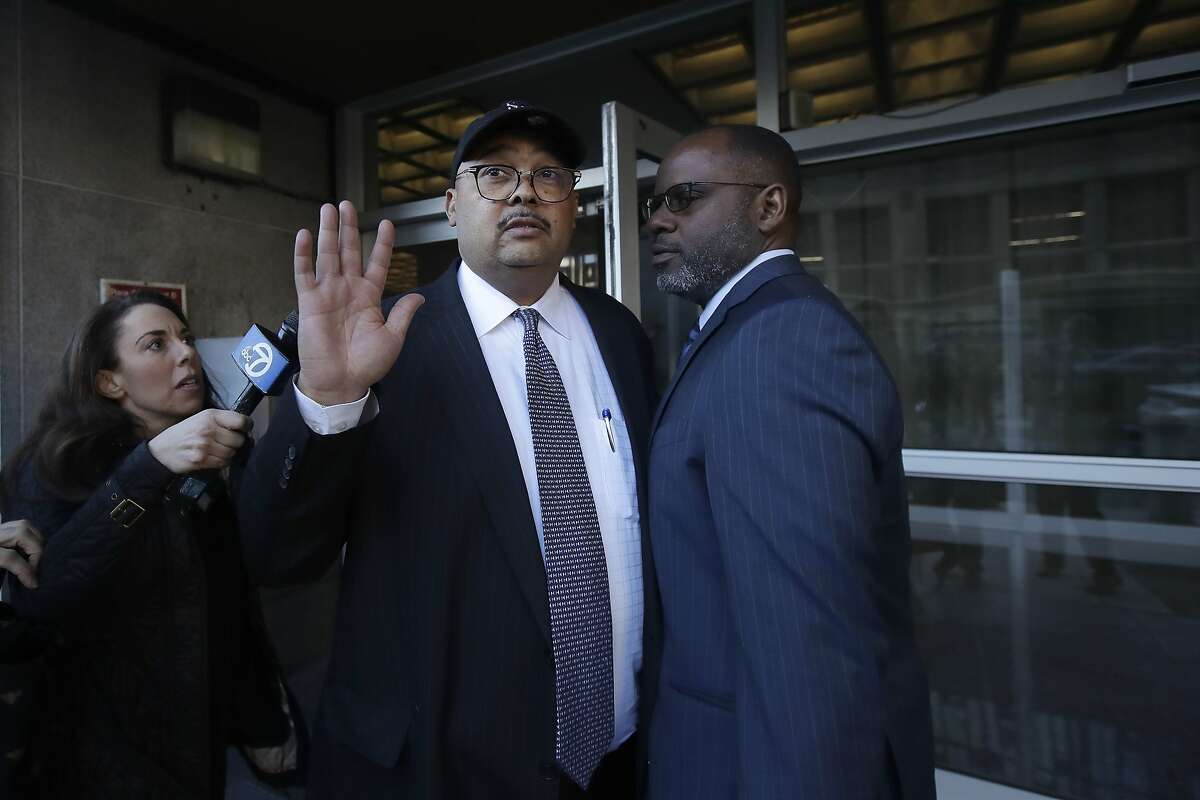 Mohammed Nuru, director of San Francisco Public Works, center, gestures as he leaves a federal courthouse with attorney Ismail Ramsey, right, in San Francisco, Thursday, Feb. 6, 2020. (AP Photo/Jeff Chiu)