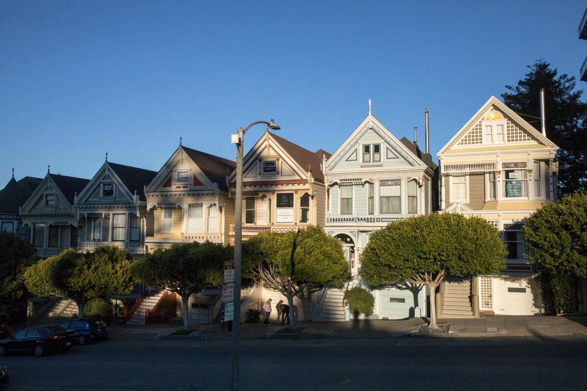 One of the famous Painted Lady houses on Steiner Street (in the center) near Alamo Square in San Francisco is for sale.