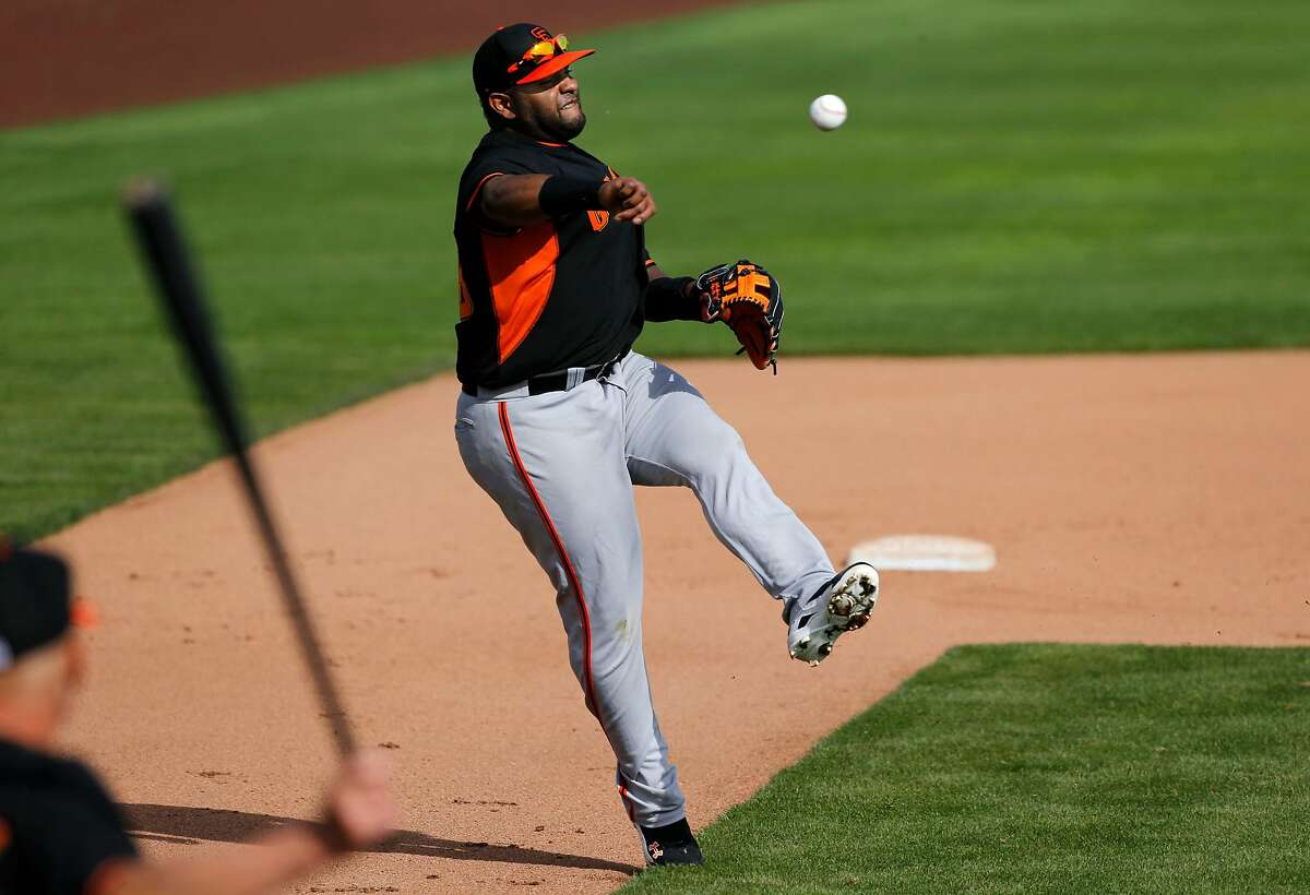 Giants' third baseman Pablo Sandoval, (48) turns and throws to first during drills at Scottsdale Stadium in Scottsdale, Arizona on Friday Feb. 21, 2014. The San Francisco Giants continue their spring training schedule in the Arizona desert in preparation for the 2014 MBL season.