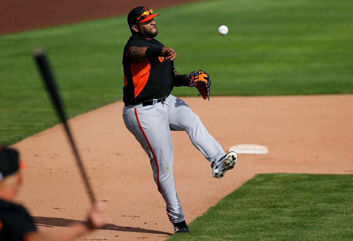 San Francisco Giants Evan Longoria makes a catch during practice