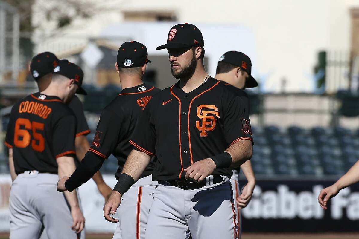 Why the Giants dugout at Scottsdale Stadium is overstuffed with players,  staff