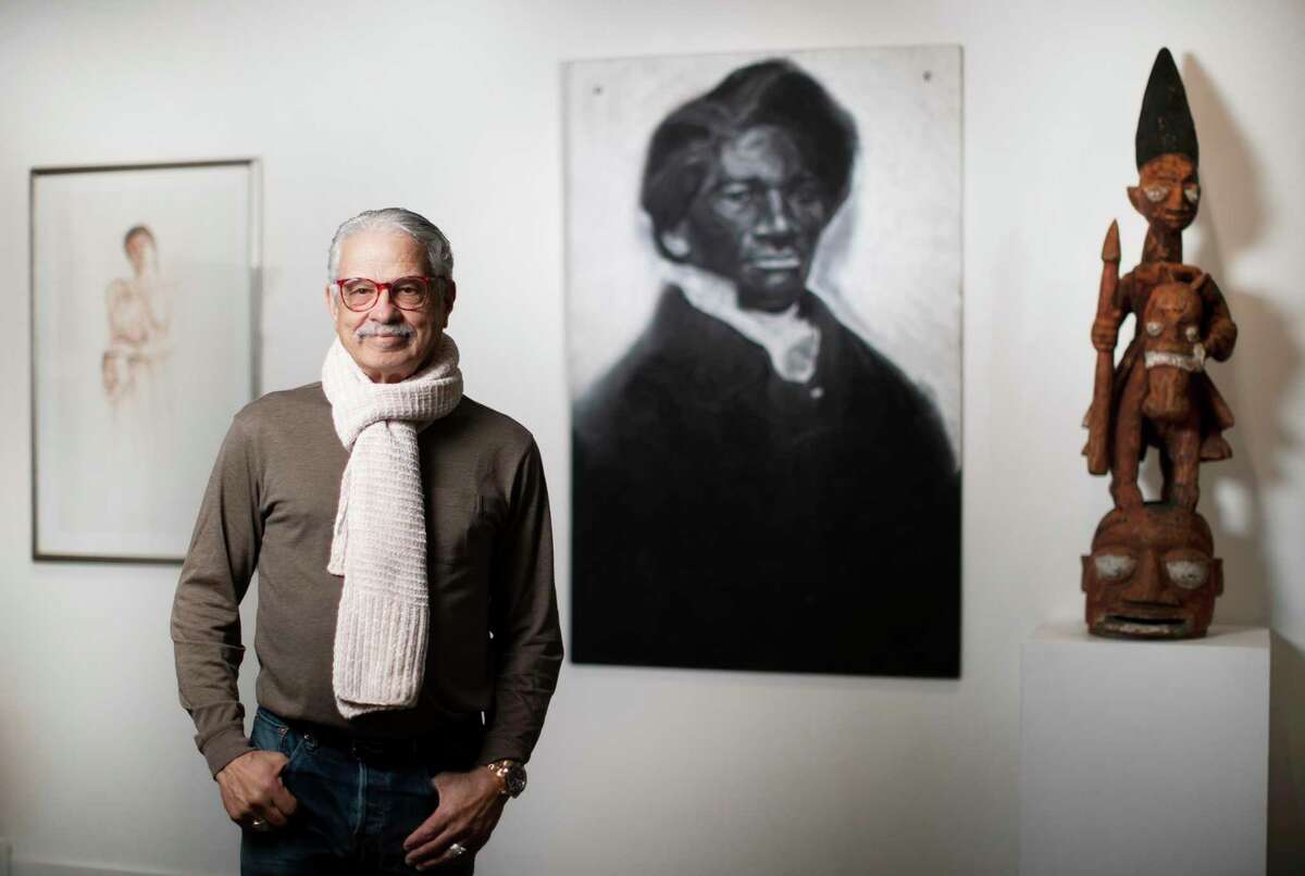 Andy Moran has spent years investing in art by painters in the Third Ward. He's accumulated a remarkable collection of art by African-American artists that is now being displayed for Black History Month at the Heidi Vaughan Fine Art gallery and he's also lecturing at TSU about the art. Moran stands for a portrait in front of a piece done in charcoal of American social reformer and writer Frederick Douglass by Julian Joseph Kyle on Tuesday, Feb. 11, 2020, in Houston.