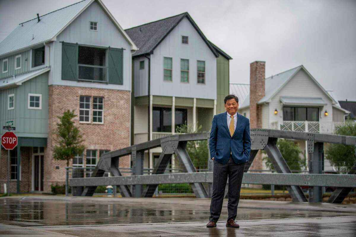 Developer Frank Liu stands on a bridge in the Kolbe Farms neighborhood, a development by InTown Homes, in the Spring Branch area of Houston, Tuesday, Dec. 10, 2019.